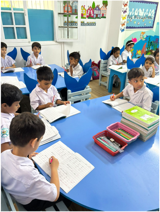 A full Warsis Montessori class working quietly at their tables