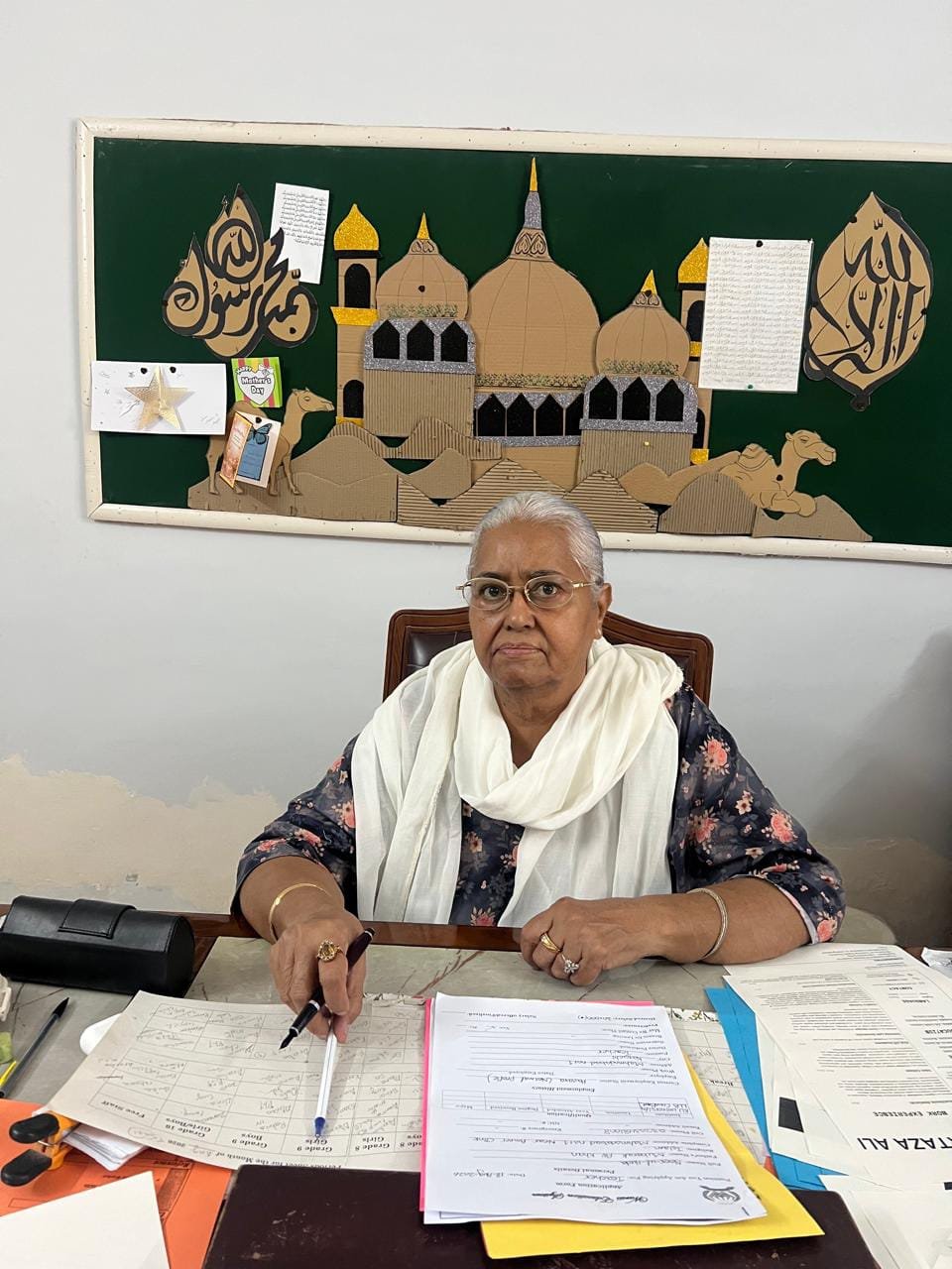 Moeen Fatima Warsis, Principal of Warsis Education System, at her office desk