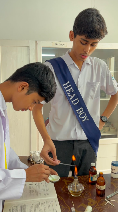 Warsis Secondary students working carefully with a spirit lamp